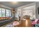 Comfortable living room showcasing hardwood floors, large windows, and a view to the dining area at 2270 Abbey Cove Ct, Marietta, GA 30062