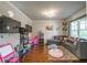 Cozy living room with hardwood floors, a plush sectional, and a view of the backyard at 2270 Abbey Cove Ct, Marietta, GA 30062