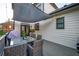 An outdoor patio featuring a shade covering, dining table and an outdoor TV at 2270 Abbey Cove Ct, Marietta, GA 30062