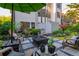 Inviting patio featuring pavers, a cozy fire pit, comfortable seating, and lush landscaping, ideal for outdoor entertaining and relaxation at 2270 Abbey Cove Ct, Marietta, GA 30062