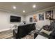 Enjoy movie nights in this cozy theater room featuring plush seating, a large screen, and themed decor at 2270 Abbey Cove Ct, Marietta, GA 30062