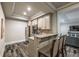 Wet bar with granite counters, stainless steel appliances and bar stool seating at 2270 Abbey Cove Ct, Marietta, GA 30062
