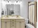 Bright bathroom features a double sink vanity with cream cabinets and a large framed mirror at 2641 Se Parks Edge Se Dr, Smyrna, GA 30080