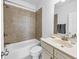 Tile bathroom with bathtub and shower includes a large mirror and vanity with a sink at 2641 Se Parks Edge Se Dr, Smyrna, GA 30080