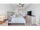 This bedroom offers a neutral color palette, tray ceiling, and spacious layout at 2641 Se Parks Edge Se Dr, Smyrna, GA 30080