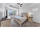 This bedroom features a tray ceiling, neutral decor, and a sunny window at 2641 Se Parks Edge Se Dr, Smyrna, GA 30080