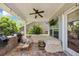 This cozy outdoor covered patio is perfect for entertaining, with a ceiling fan, grill and TV at 2641 Se Parks Edge Se Dr, Smyrna, GA 30080