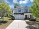 Charming two-story home featuring a well-manicured front yard and attached two-car garage at 2641 Se Parks Edge Se Dr, Smyrna, GA 30080