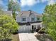 A beautifully landscaped two-story home with a gray exterior, attached garage, and inviting curb appeal at 2641 Se Parks Edge Se Dr, Smyrna, GA 30080