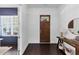 Bright foyer featuring dark wood floors and a decorative front door and sidelight at 2641 Se Parks Edge Se Dr, Smyrna, GA 30080