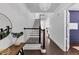 Hallway with hardwood floors, access to stairs and other rooms, and a pendant light at 2641 Se Parks Edge Se Dr, Smyrna, GA 30080