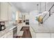 Spacious kitchen with an island, stainless steel appliances, and staircase in view at 2641 Se Parks Edge Se Dr, Smyrna, GA 30080