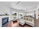 Open concept living room with fireplace, modern lighting, and hardwood floors at 2641 Se Parks Edge Se Dr, Smyrna, GA 30080