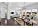 Spacious living room with hardwood floors, fireplace, and large windows offering natural light at 2641 Se Parks Edge Se Dr, Smyrna, GA 30080