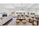 Open-concept living room with hardwood floors, fireplace, and large windows at 2641 Se Parks Edge Se Dr, Smyrna, GA 30080