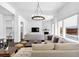 Spacious living room with a large sectional sofa, fireplace, and hardwood floors at 2641 Se Parks Edge Se Dr, Smyrna, GA 30080