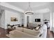 Bright living room with large sectional sofa, fireplace, and hardwood floors at 2641 Se Parks Edge Se Dr, Smyrna, GA 30080