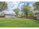 Expansive backyard featuring a lush lawn, mature trees, playset, storage shed, and gazebo at 4061 Newman Ellis Rd, Douglasville, GA 30134