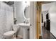 Bright bathroom featuring a pedestal sink, oval mirror, and charming leaf-patterned shower curtain at 4061 Newman Ellis Rd, Douglasville, GA 30134
