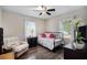 This bright bedroom with a daybed offers a relaxing retreat filled with natural light at 4061 Newman Ellis Rd, Douglasville, GA 30134