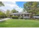 Charming single-story home with a well-maintained front yard and beautiful landscaping at 4061 Newman Ellis Rd, Douglasville, GA 30134