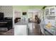 An inviting open-concept kitchen with an island, wood floors, and views of the dining and living areas at 4061 Newman Ellis Rd, Douglasville, GA 30134