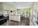 A modern and stylish kitchen offers a smooth transition to the dining area and living room at 4061 Newman Ellis Rd, Douglasville, GA 30134