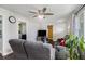 Living room with paneled walls, wood floors, and an open layout connected to the kitchen at 4061 Newman Ellis Rd, Douglasville, GA 30134