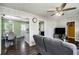 View of the living room flowing into the dining area, featuring wood-look flooring at 4061 Newman Ellis Rd, Douglasville, GA 30134