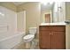Bathroom featuring a bathtub and shower combination and wooden vanity at 527 Pringle Dr, Suwanee, GA 30024