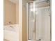 Bathroom with a soaking tub and glass-enclosed shower at 527 Pringle Dr, Suwanee, GA 30024