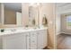 En-suite bathroom features double sinks, plenty of counter space, and views to the bedroom at 527 Pringle Dr, Suwanee, GA 30024