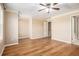 A large bedroom features tray ceilings, wood floors, and neutral walls at 527 Pringle Dr, Suwanee, GA 30024