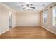 A spacious main bedroom boasts tray ceilings and light-filled windows at 527 Pringle Dr, Suwanee, GA 30024