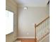 Inviting entryway with hardwood floors, staircase, and natural light, creating a warm and welcoming ambiance at 527 Pringle Dr, Suwanee, GA 30024
