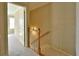 Light and airy hallway featuring neutral tones and a classic wooden banister at 527 Pringle Dr, Suwanee, GA 30024
