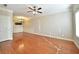 Bright and airy living room with gleaming hardwood floors, chandelier, and elegant wainscoting at 527 Pringle Dr, Suwanee, GA 30024