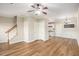 Spacious living room with hardwood floors, crown molding, and staircase leading to upper level at 527 Pringle Dr, Suwanee, GA 30024