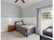 This cozy bedroom is well-lit and features gray walls, white trim, and neutral carpet at 2106 Berryhill Se Cir, Smyrna, GA 30082