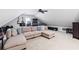 Large bonus room featuring a ceiling fan, sectional sofa, and lots of open space at 2106 Berryhill Se Cir, Smyrna, GA 30082
