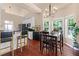 Bright breakfast nook with modern lighting, bar seating, and a view into kitchen at 2106 Berryhill Se Cir, Smyrna, GA 30082