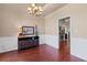 Elegant dining area with hardwood floors, wainscoting, a modern console table, and a view into the adjacent kitchen at 2106 Berryhill Se Cir, Smyrna, GA 30082