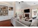Open-concept living room with fireplace, built-in shelves, and comfortable seating at 2106 Berryhill Se Cir, Smyrna, GA 30082