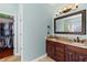 Main bathroom with double vanity, granite countertops, and walk-in closet access at 2106 Berryhill Se Cir, Smyrna, GA 30082