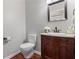 This powder room has a wood cabinet with marble countertop, round sink and a decorative mirror at 2106 Berryhill Se Cir, Smyrna, GA 30082