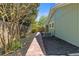 Landscaped backyard with a brick walkway, mulch, and an air conditioning unit at 350 Somerset Se Ln, Marietta, GA 30067