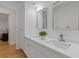 Bathroom featuring double sinks, marble countertops, modern faucets, and decorative accents at 350 Somerset Se Ln, Marietta, GA 30067