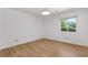 Bright bedroom with hardwood flooring and a large window allowing for natural light at 350 Somerset Se Ln, Marietta, GA 30067