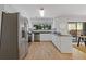 Bright kitchen with stainless steel appliances, granite countertops, and a view to outdoor living space at 350 Somerset Se Ln, Marietta, GA 30067