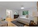 Calm main bedroom with hardwood floors, neutral decor, and adjacent ensuite bathroom at 350 Somerset Se Ln, Marietta, GA 30067